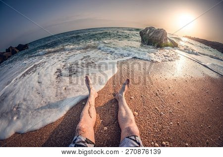 Relaxation On The Sea Sitting On The Beach, On The Sunset, First-person View, Fisheye Distortion