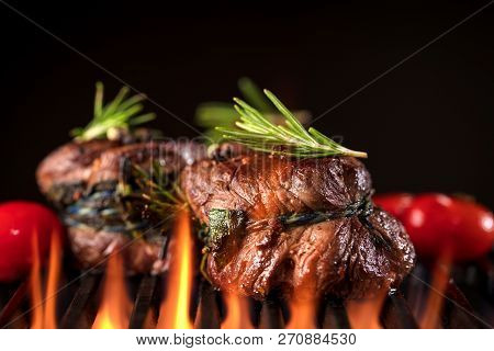 Fresh Fillet Steak On Grill With Flammes.