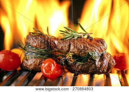 Fresh Fillet Steak On Grill With Flammes.