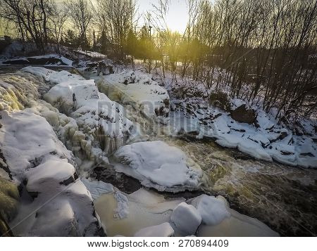 The Water Of The River Is Still Circulating, The Sides Begin To Freeze. We Can See Beautiful Icy For