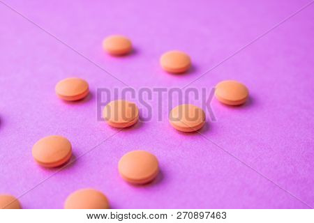 Small Yellow Orange Beautiful Medical Pharmaceptic Round Pills, Vitamins, Drugs, Antibiotics On A Pi