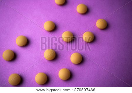 Small Yellow Orange Beautiful Medical Pharmaceptic Round Pills, Vitamins, Drugs, Antibiotics On A Pi