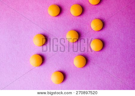 Small Yellow Orange Beautiful Medical Pharmaceptic Round Pills, Vitamins, Drugs, Antibiotics On A Pi