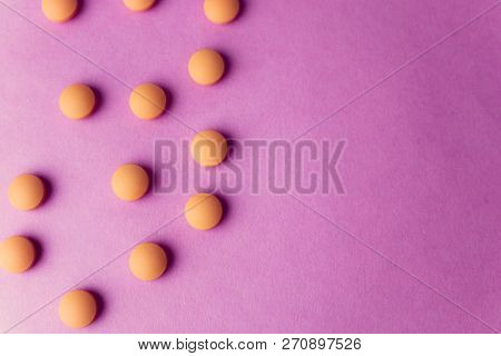 Small Yellow Orange Beautiful Medical Pharmaceptic Round Pills, Vitamins, Drugs, Antibiotics On A Pi