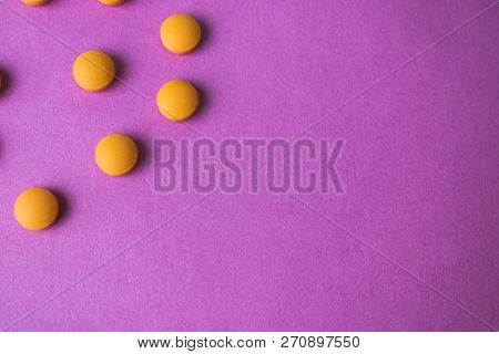 Small Yellow Orange Beautiful Medical Pharmaceptic Round Pills, Vitamins, Drugs, Antibiotics On A Pi