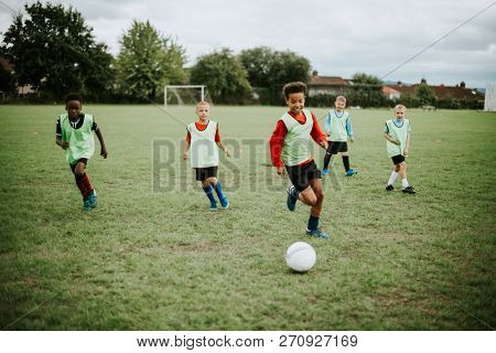 Junior football team playing on the field
