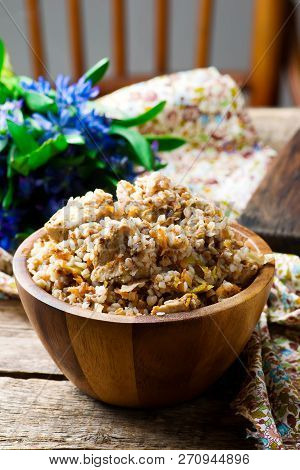 Buckwheat With Vegetables And Chicken Prepared In The Crock-pot. Selective Focus.
The Image Is Tinte