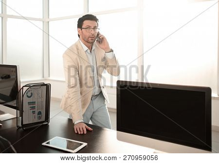 background image of a businessman in a modern office.