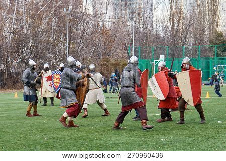 Moscow, Russia - November 17, 2018. Medieval Knights Fighting With Swords And Shields. Reconstructio