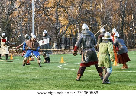 Moscow, Russia - November 17, 2018. Medieval Knights Fighting With Swords And Shields. Reconstructio