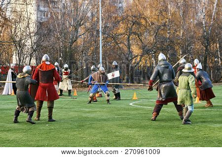 Moscow, Russia - November 17, 2018. Medieval Knights Fighting With Swords And Shields. Reconstructio