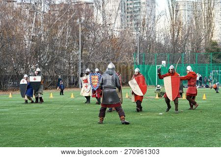 Moscow, Russia - November 17, 2018. Medieval Knights Fighting With Swords And Shields. Reconstructio