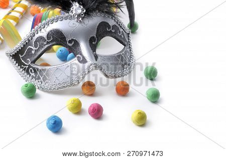 Carnival Mask Among Colorful Cotillon On White Background