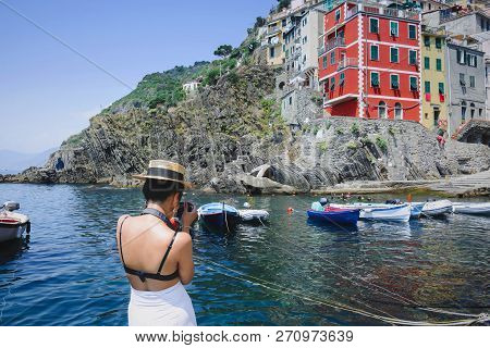 Riomaggire, Italy, La Specia Province, Liguria Regione, 11 August, 2018: Girl Takes A Photo Of The V