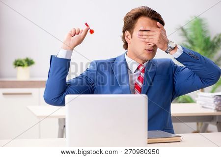 Businessman throwing dart in business concept
