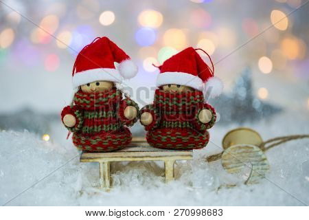 Two Gnoms On Sled, Snow And Bokeh, White Background