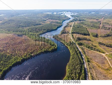 View Of Kalix River, Kalixalven, Overkalix Locality And The Seat In Norrbotten County, Sweden, With