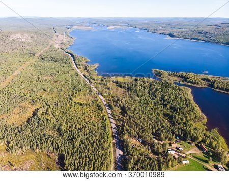 View Of Kalix River, Kalixalven, Overkalix Locality And The Seat In Norrbotten County, Sweden, With