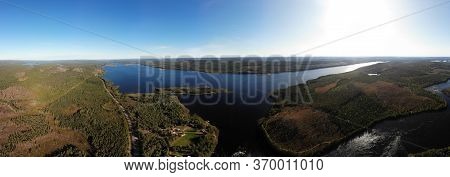 View Of Kalix River, Kalixalven, Overkalix Locality And The Seat In Norrbotten County, Sweden, With