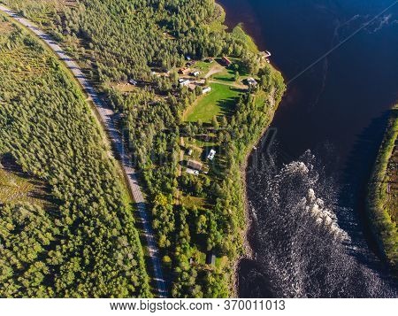 View Of Kalix River, Kalixalven, Overkalix Locality And The Seat In Norrbotten County, Sweden, With
