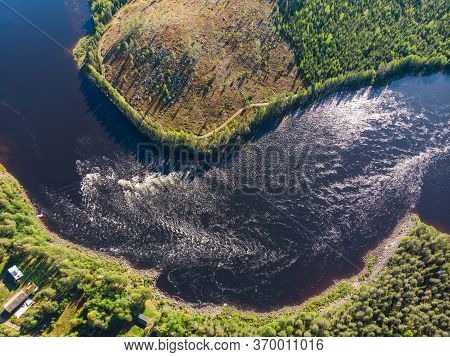 View Of Kalix River, Kalixalven, Overkalix Locality And The Seat In Norrbotten County, Sweden, With