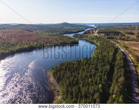 View Of Kalix River, Kalixalven, Overkalix Locality And The Seat In Norrbotten County, Sweden, With