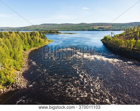 View Of Kalix River, Kalixalven, Overkalix Locality And The Seat In Norrbotten County, Sweden, With