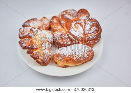 Sweet Bun On A Plate With A White Background