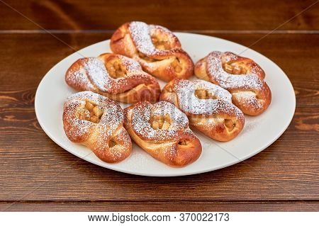 A Plate Of Food On A Wooden Table