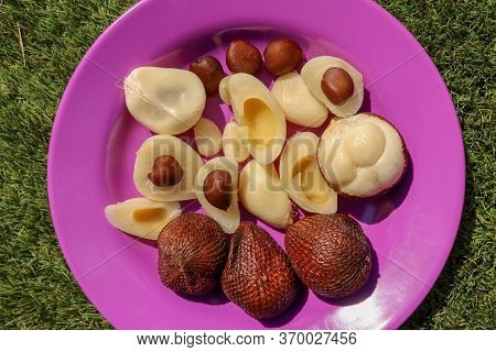 Close Up Of Peeled, Cuted And Whole Pieces Of Snake Fruit With Seed. Top View Of Healthy Fruit. Sala