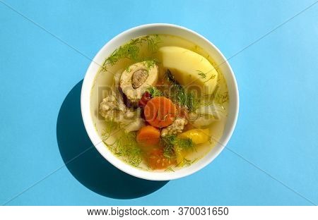 Shurpa Soup In A White Bowl On Dark Wooden Background. Top View. Famous Traditional Asian, Uzbek, Mi