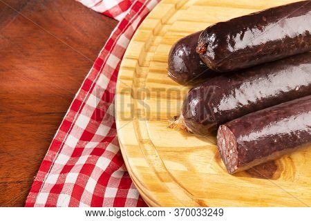 Blood Sausage Morcilla - Text Space. Wood Background