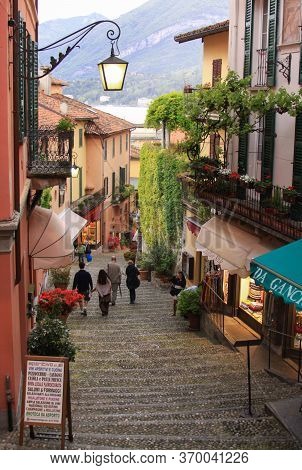 Bellagio, Italy - May 23, 2013: Illustrative Editorial - Alley View And Stairs Going To The Port In 