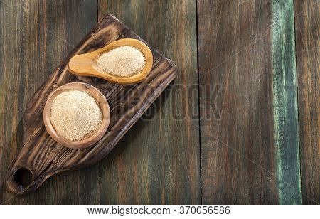 Maca Root Powder - Lepidium Meyenii. Wood Background