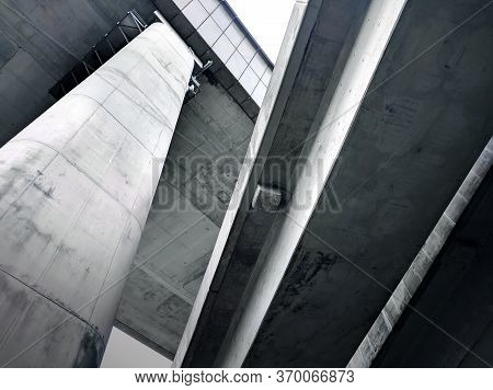 Underside View Of Intersecting Concrete Bridges With Defined Geometry And Shadows In Hong Kong