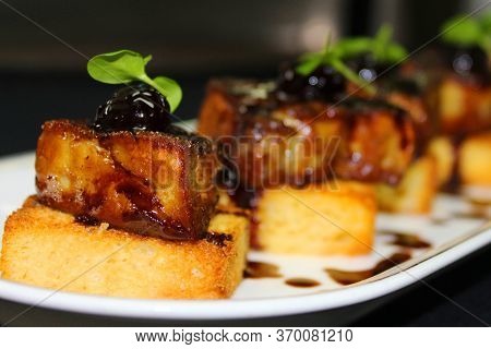 Pan Fried Duck Foie Gras On Toasted Brioche Bread And Amarena Cherry