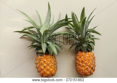 Couple Whole Pineapple Tropical Fruit Or Ananas Isolated On White Background. Whole Ananas With Leav