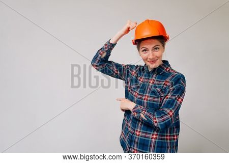 Portrait Of A Young Girl Architect Who Knocks Her Hand On The Head. Customer Outrage Or Non-acceptan