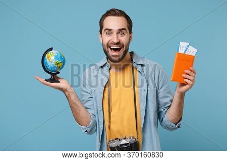 Excited Traveler Tourist Man In Yellow Clothes With Photo Camera Isolated On Blue Background. Male P