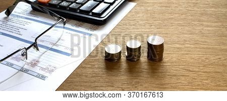 Coins With Calculator On Financial Diagrams. Finance Conzept