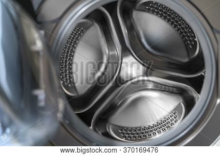 Empty Front-loaded Washing Machine Drum, Close Up Opened Washing Machine, Front Door.