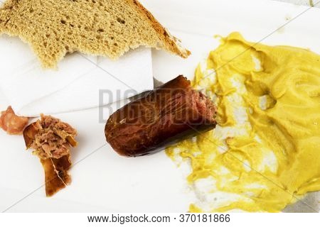 Leftover Food, Czech Sausages, Mustard, Bread On The Table.