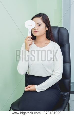 Consultation With An Ophthalmologist. Young Asian Woman In Clinic Office.