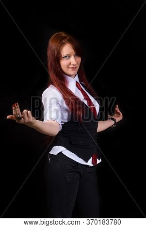 A Defiant, Strict, Discontented Red-haired Girl Shows A Discontented Gesture, Dressed As An Office W