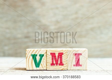 Alphabet Letter In Word Vmi (abbreviation Of Vendor Managed Inventory) On Wood Background