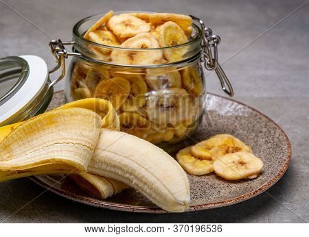 Healthy Snack, Crispy Dehydrated Unsugared Banana Chips In Glass Jar