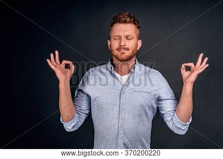 Stress Goes Away With Meditation. Portrait Of Charming Relaxed And Calm European Man With Redbeard A