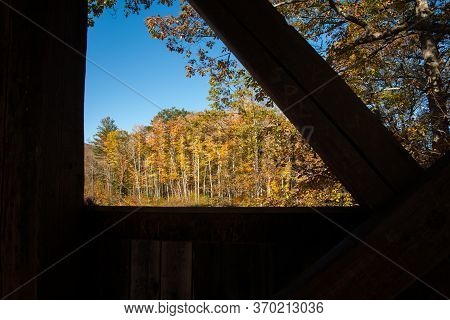 Auntumn Colors View Through Structural Detail Of Sunday River Historic Covered Bridge, Sunday River,