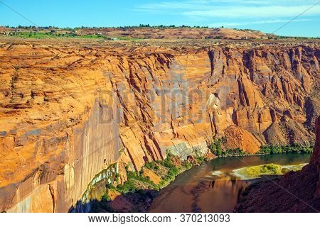 The Colorado River is swift USA river. Best journey in life. Glen Canyon Dam across the Colorado River. Concept of active, ecological and photo toursm