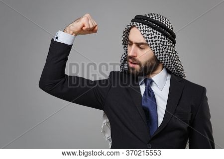 Strong Bearded Arabian Muslim Businessman In Keffiyeh Kafiya Ring Igal Agal Classic Black Suit Tie I